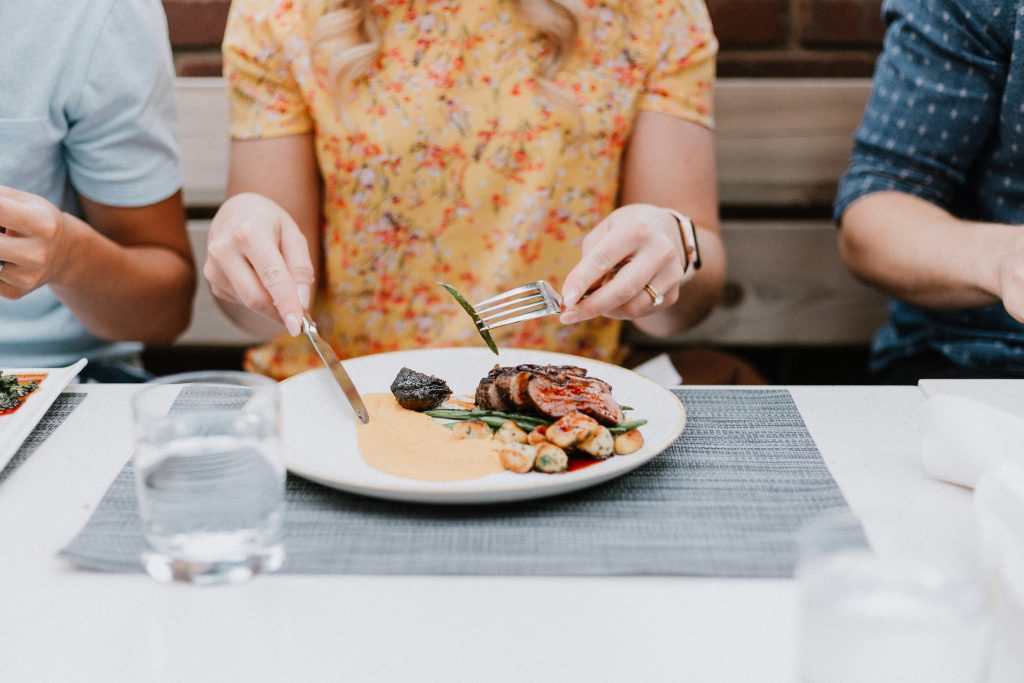 Woman eating a healthy meal to support immune health and long-term vitality through diet