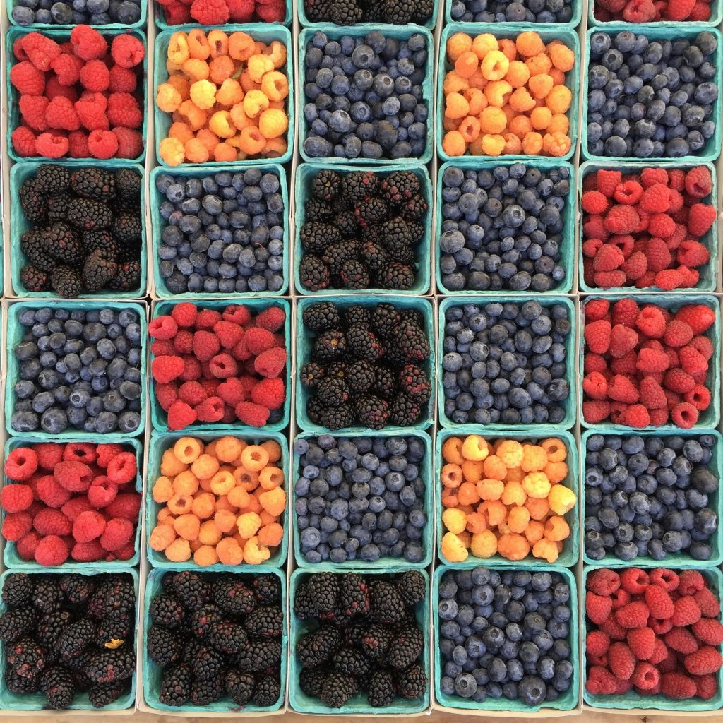 A colorful grid of antioxidant-rich berries and fruits, illustrating the importance of antioxidants and liver support in a healthy diet.