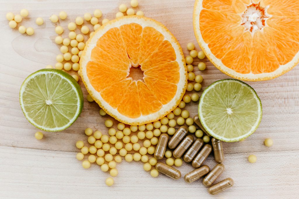 Fresh citrus fruits and fermented sauerkraut, highlighting mood-boosting probiotics for the gut-brain axis.