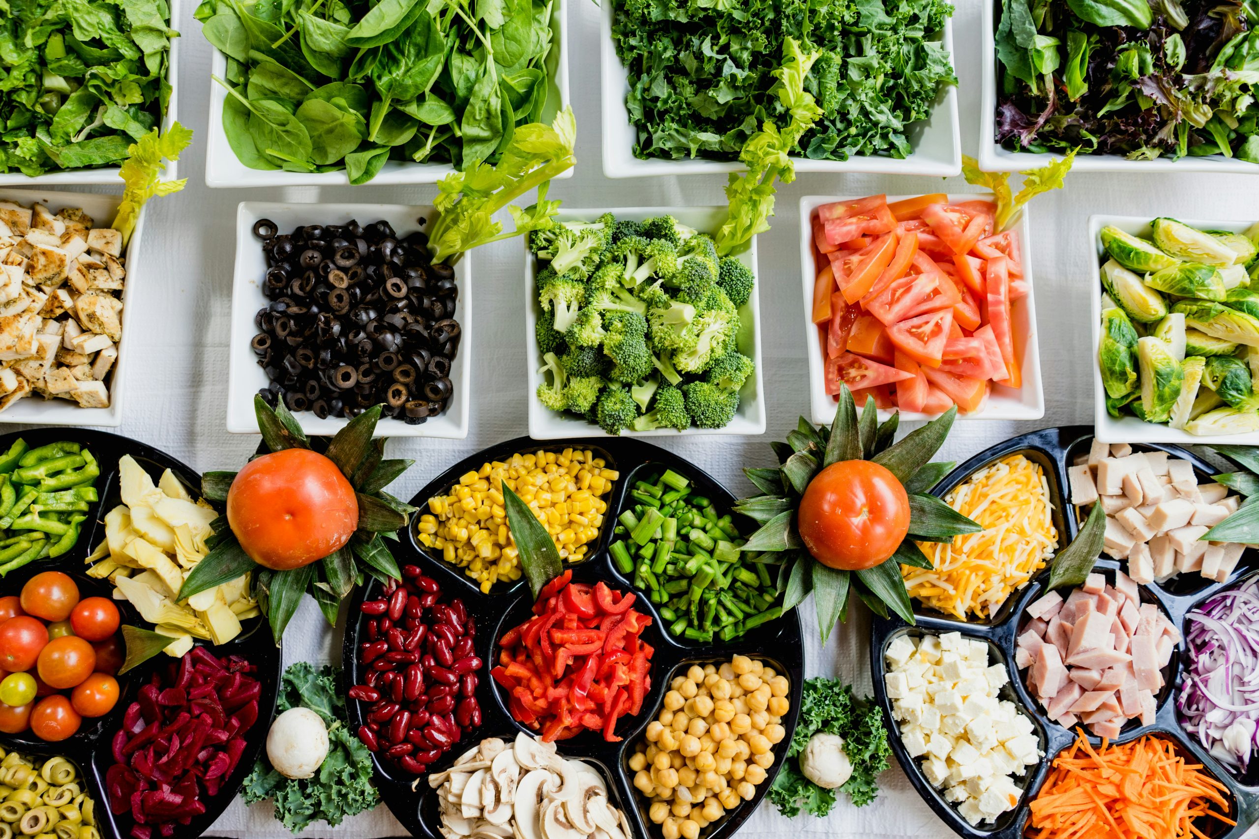 A bright flat-lay of fresh detox ingredients, lemon water, and herbal tea